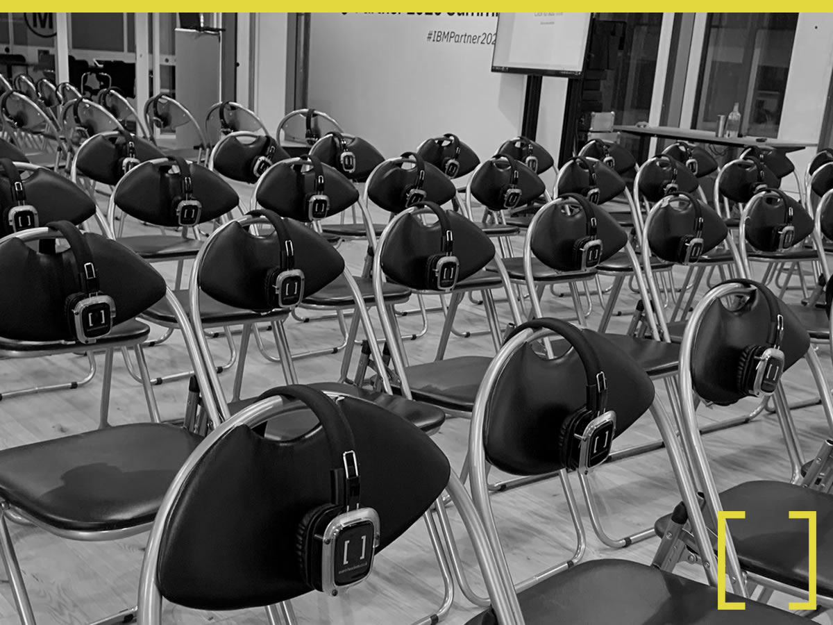 Delegates in a breakout training session wearing headsets