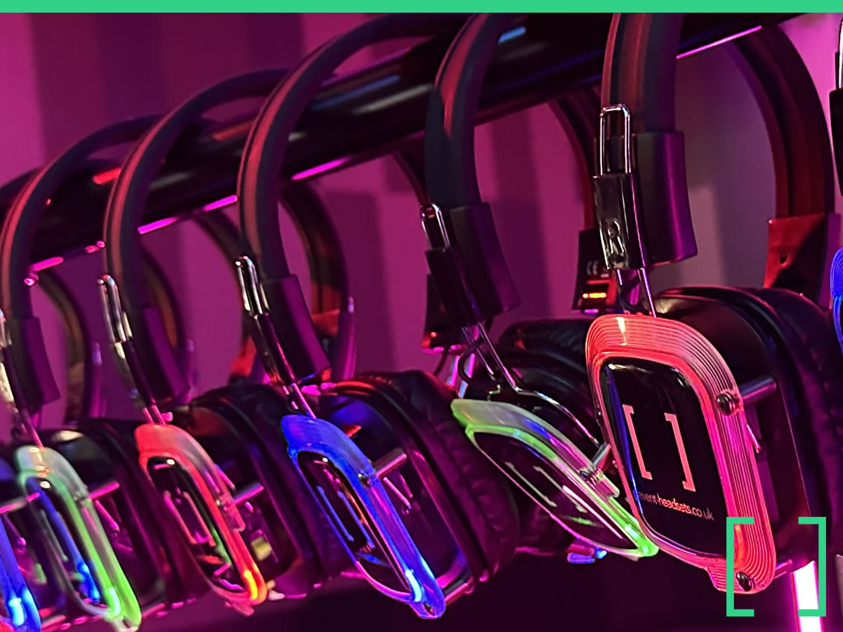 Corporate conference delegates wearing wireless headsets