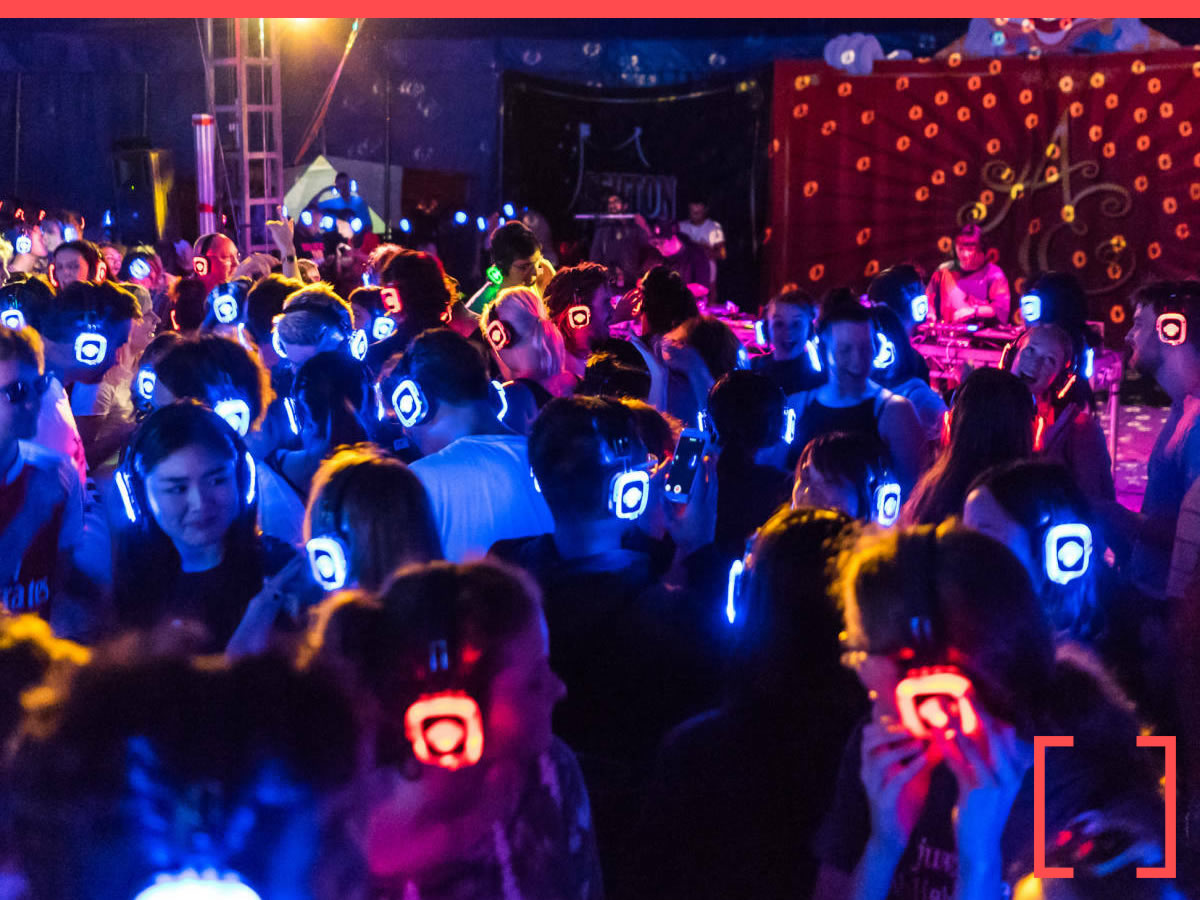 Guests wearing LED silent disco headsets at a corporate party