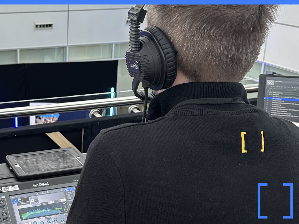 On-site technician setting up headset transmitters